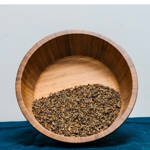 Holy Basil Tulsi (Ocimum Tenuiflorum) dried herb in wooden bowl