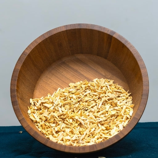 Quassia Chips (Quassia Amara) pale wood chips in wooden bowl